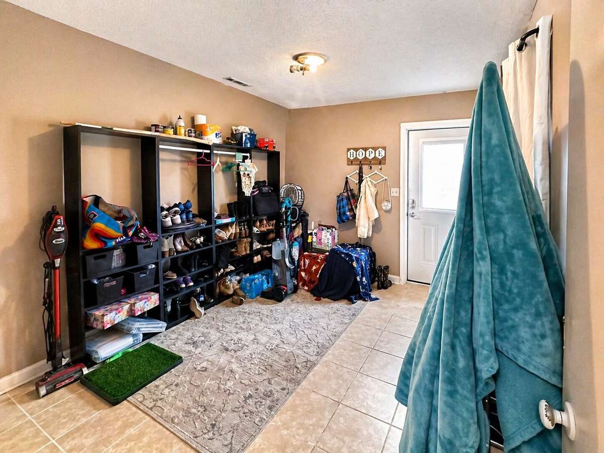 Basement room with utility connections and full bathroom with shower only. Could be a 4th bedroom or office.