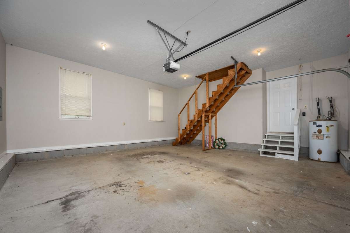 Garage stairs leading up into the attic.