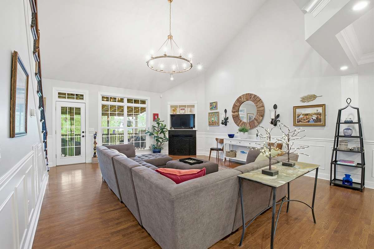 Spacious living room w/double height vaulted ceiling