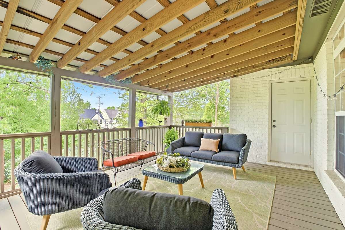 Charming covered back deck w/storage