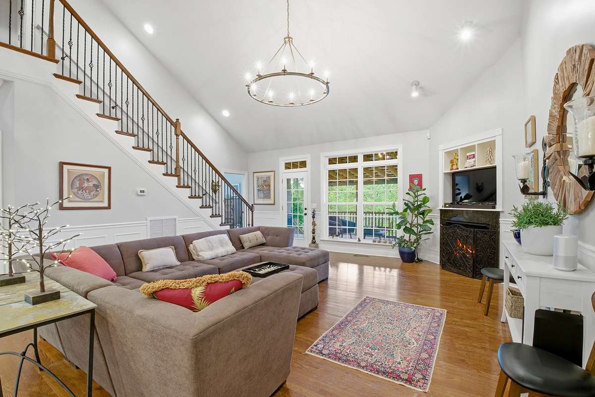 Cozy gas fireplace and easy access to deck for indoor-outdoor entertaining