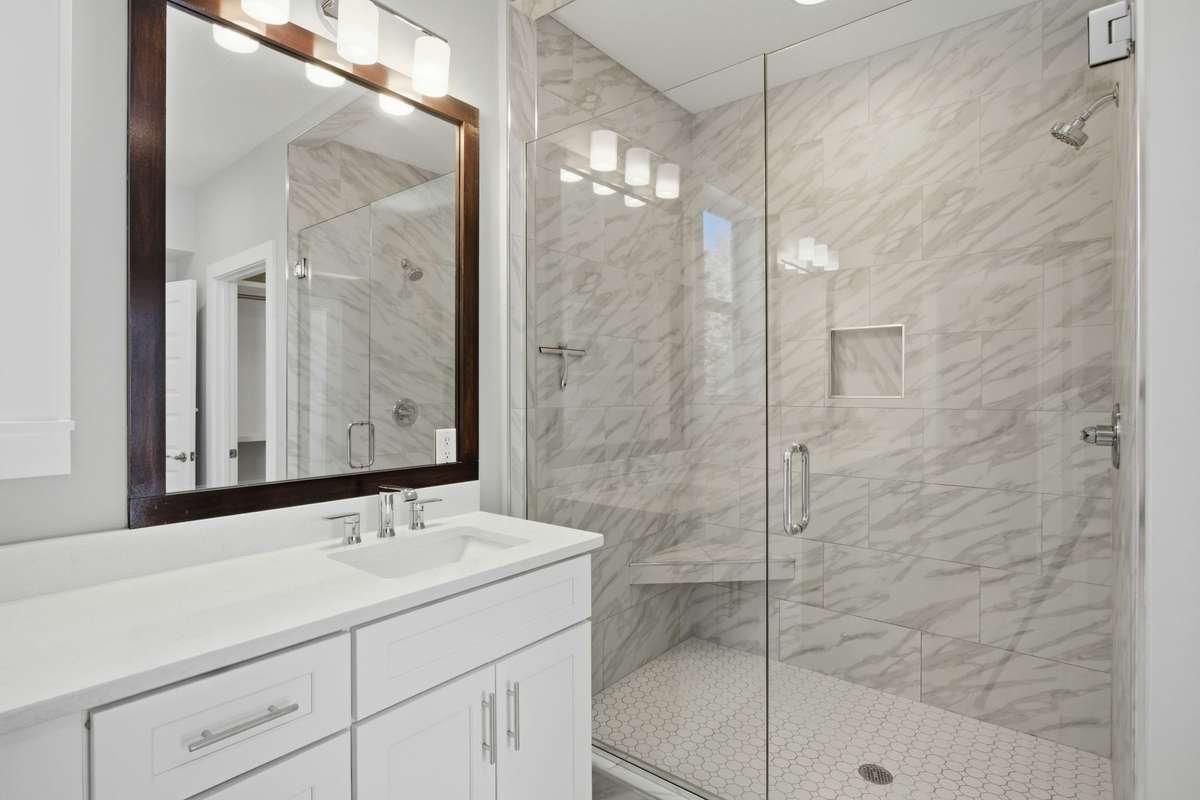 Primary bathroom designed for comfort and style, with modern finishes and a spa-like feel