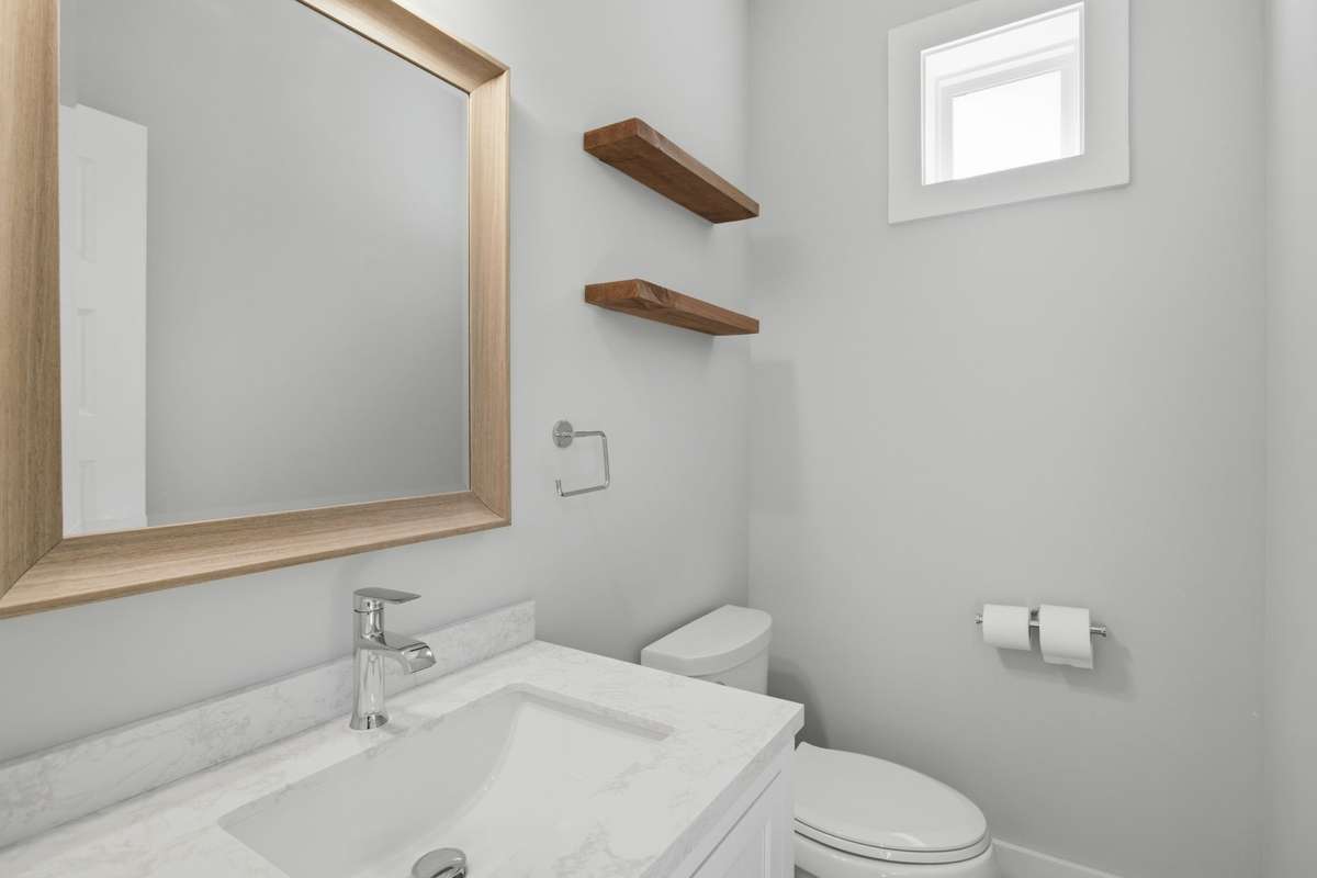 Half bath located on the second level just off the living / kitchen space.