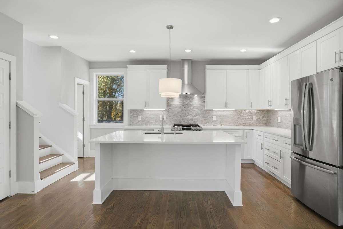 Beautifully designed kitchen with stainless appliances.