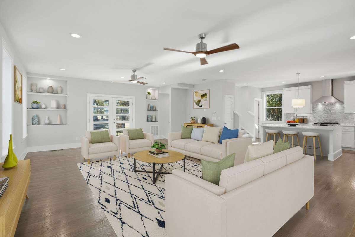 Another view of the living area. Photo enhanced with virtual staging. No furniture or décor is physically present.