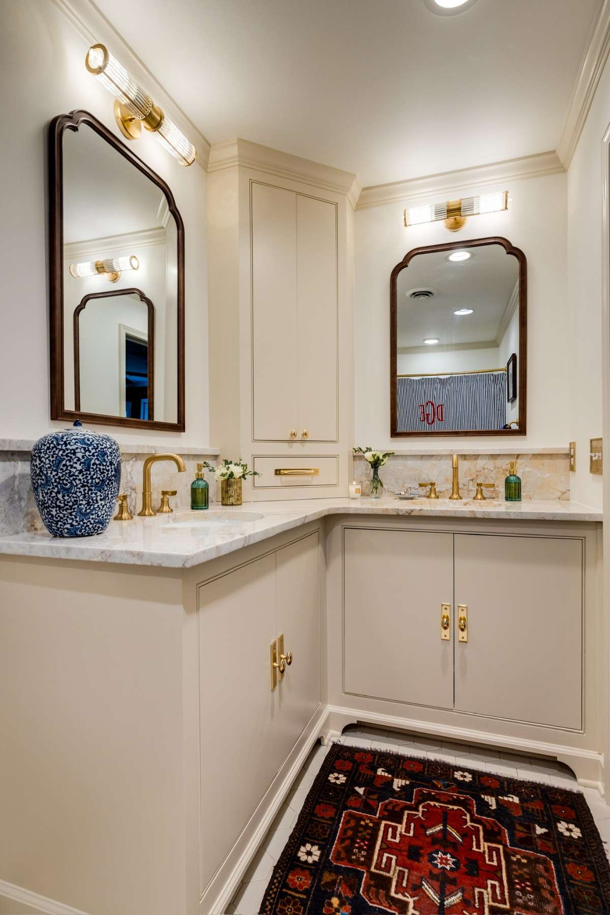 Primary Bath has been completely redesigned with both beauty AND organization in mind boasting a storage tower (with even more hidden space below) + stunning double vanities.