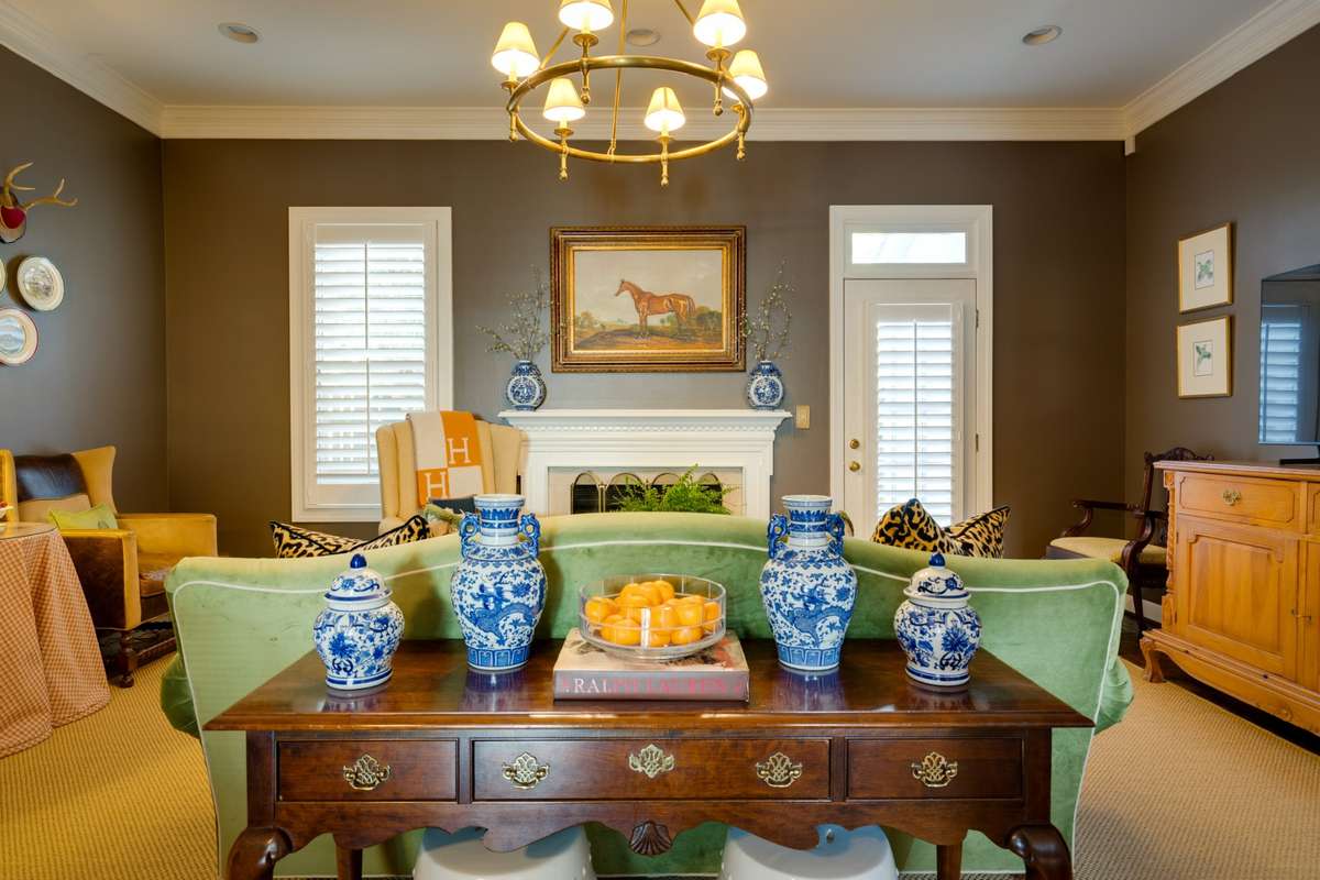 Living Room is made cozy by the Fireplace and shades of rich, chocolate brown.