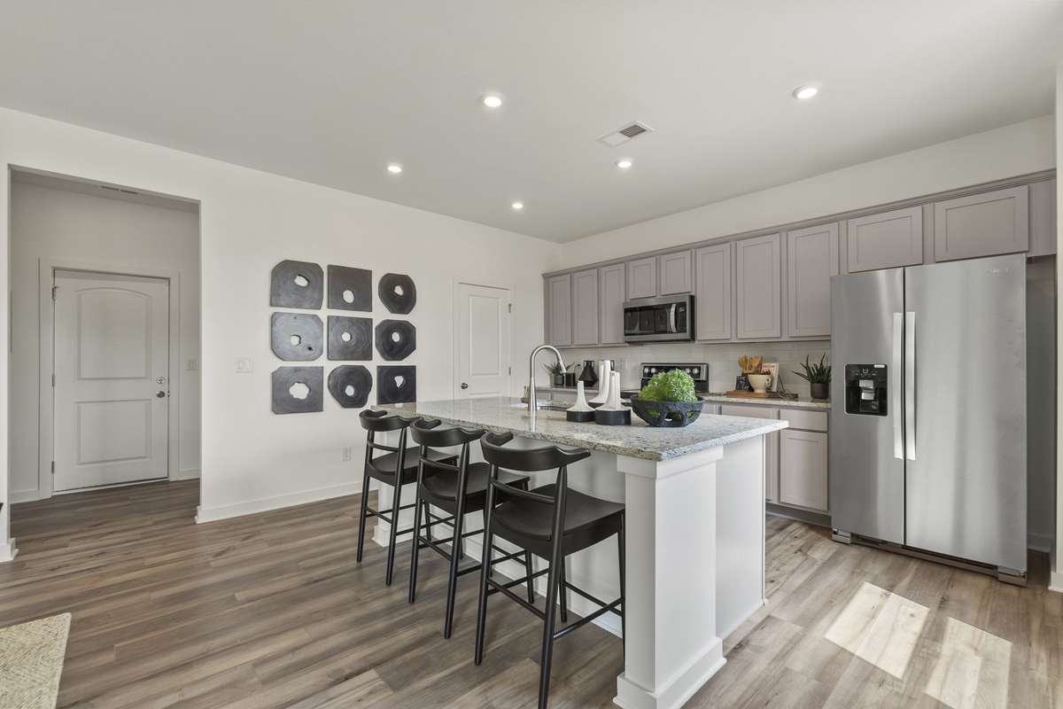 Kitchen and garage entry
(furnished model home photo)