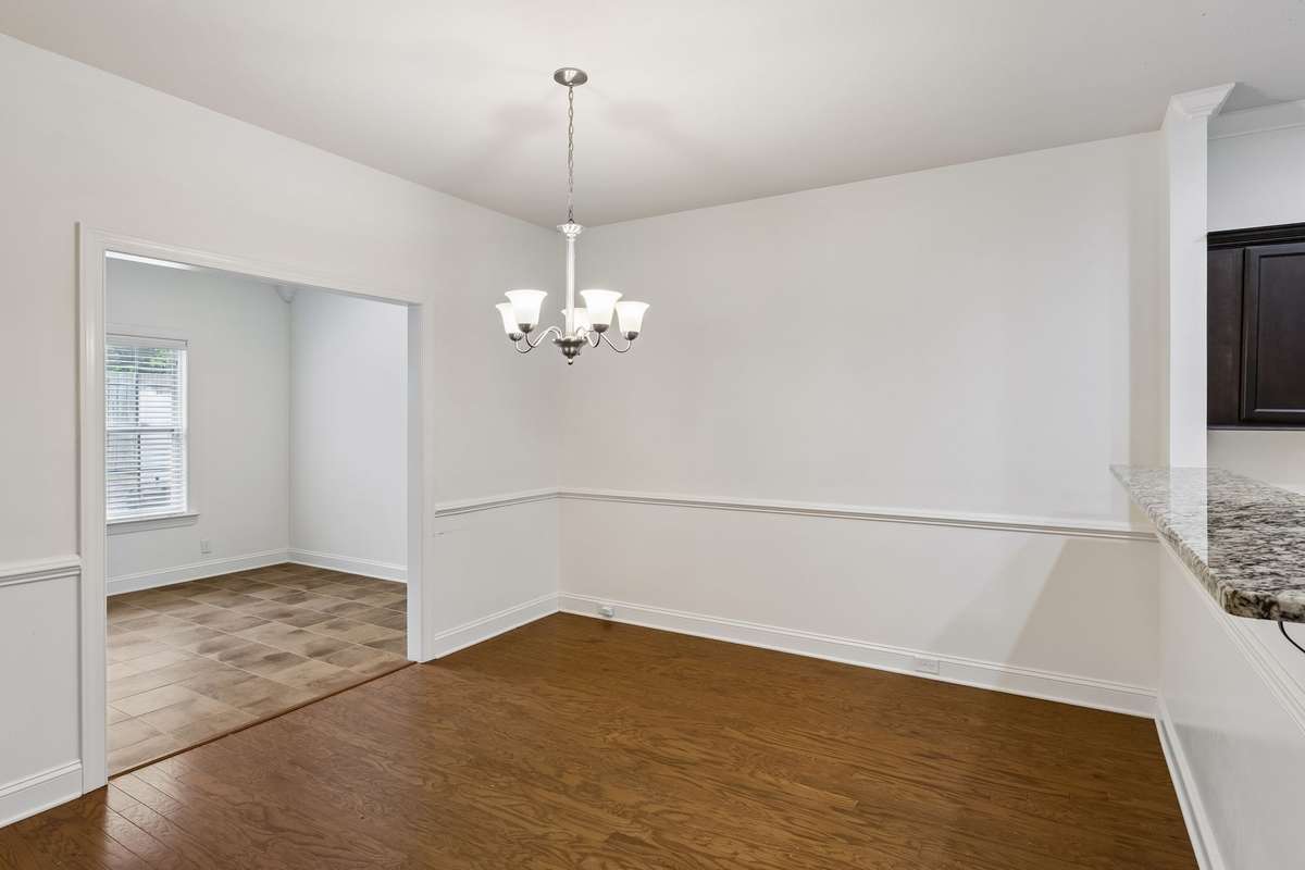 Dining room features hardwood flooring and leads to the Florida room! 217 Whiteamore Run, Murfreesboro, TN 37128