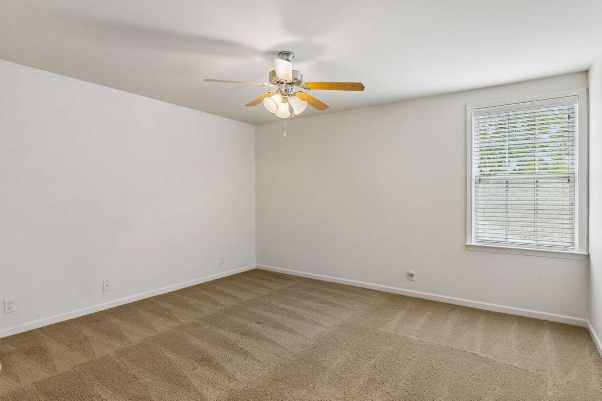 Bedroom two with double closet, ceiling fan, and soft carpeting! 217 Whiteamore Run, Murfreesboro, TN 37128