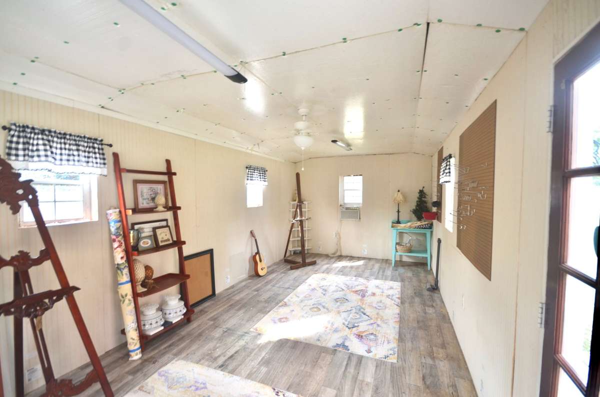 Inside She Shed with window air condition unit