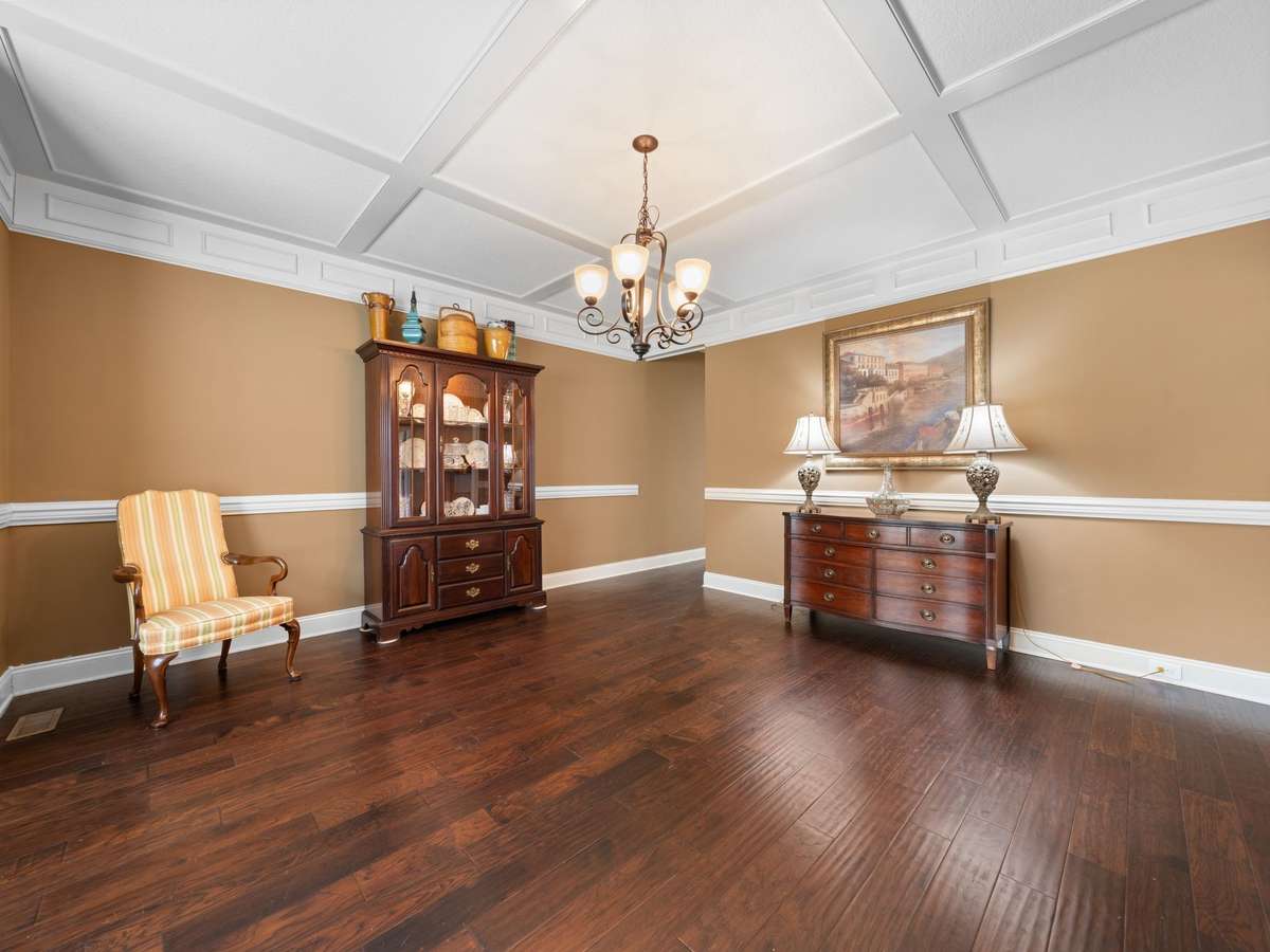 Dining room view opening into kitchen