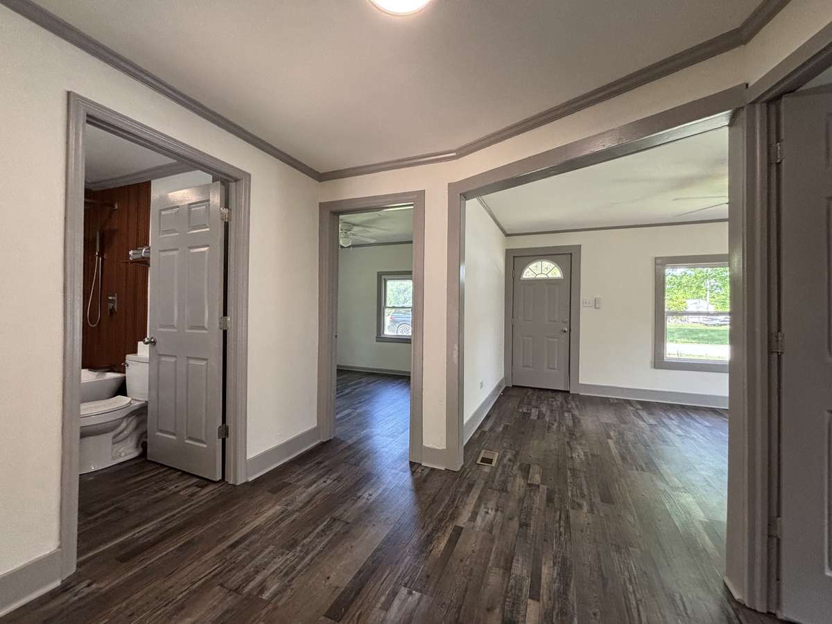 Showing Hallway,  Bath to Left, Living Room to the Right