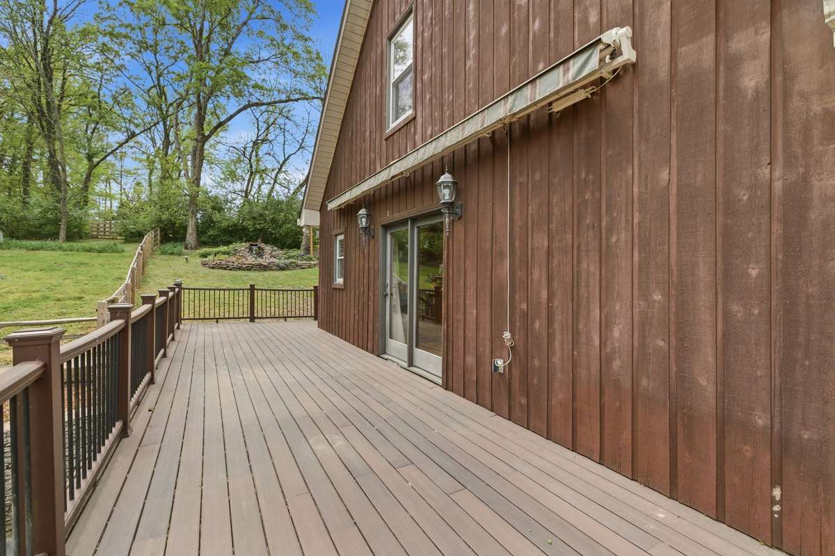 Trex decking and Sunsetter shade off the primary wing ( self retracting in case of wind )