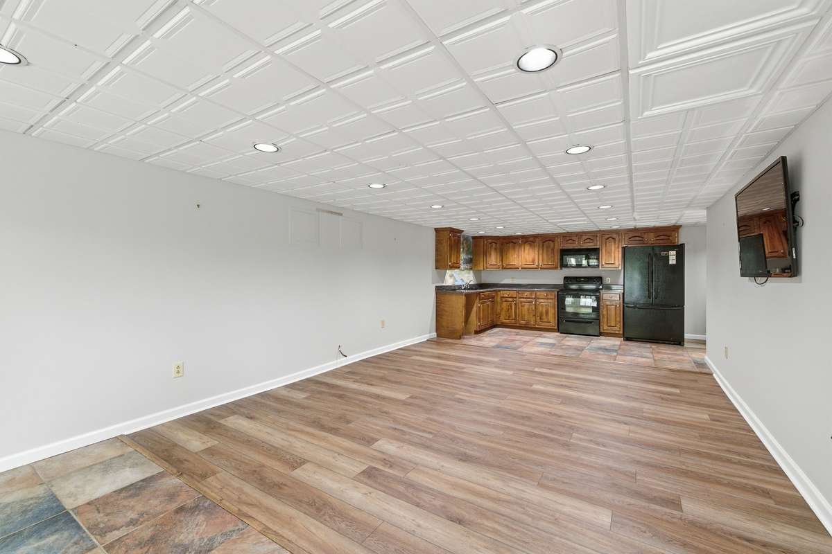 basement level mother-in-law/teen suite (wall mounted tv stays)