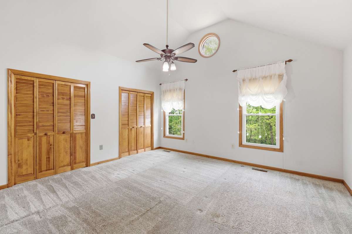 main level primary bedroom, high ceilings, double closets
