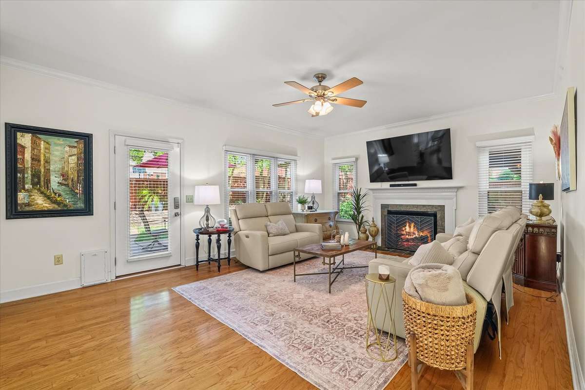 Cozy up in the back living room with peaceful views of your backyard oasis—your new favorite spot to unwind (and maybe never leave).