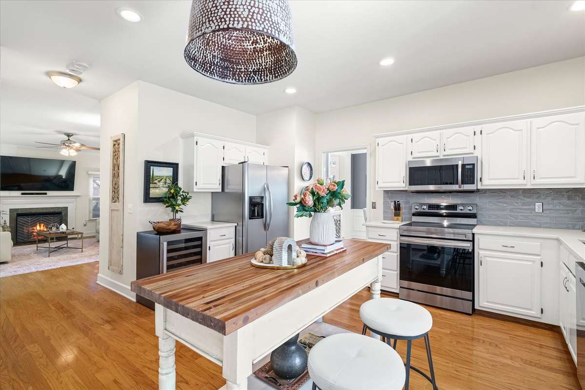 The center piece is not a fixed island and will not convey—giving you the flexibility to add the island or eat-in table that fits your style (and your family routine).