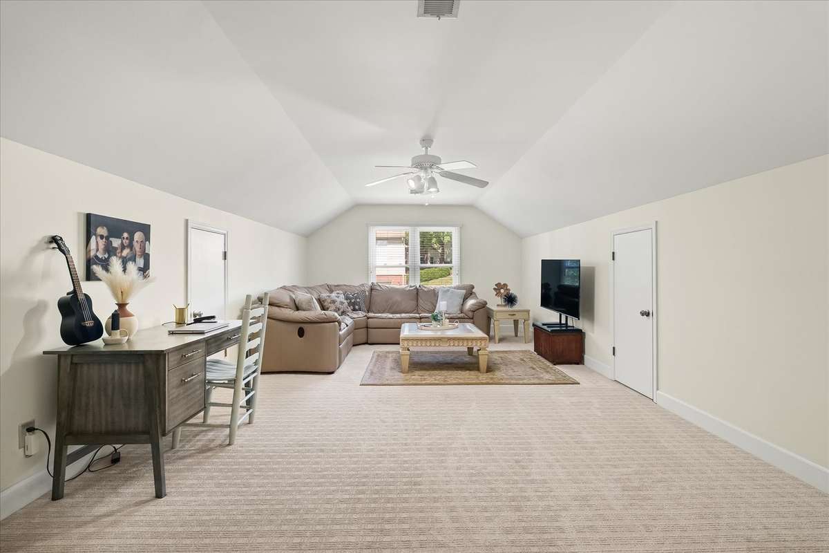 Large bonus room with storage that runs the length of the bonus room on both sides