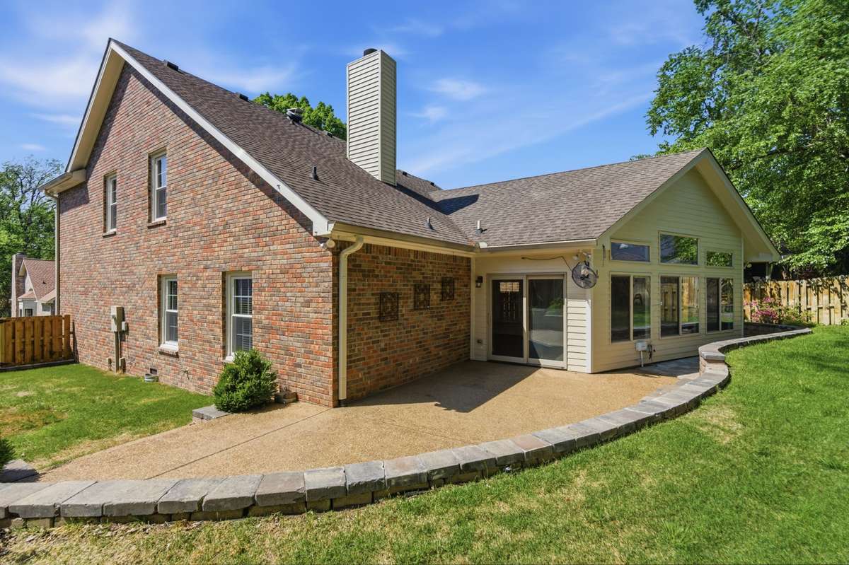 Expanded outdoor living with extensive hardscape, creating a spacious patio setting for outdoor entertaining.