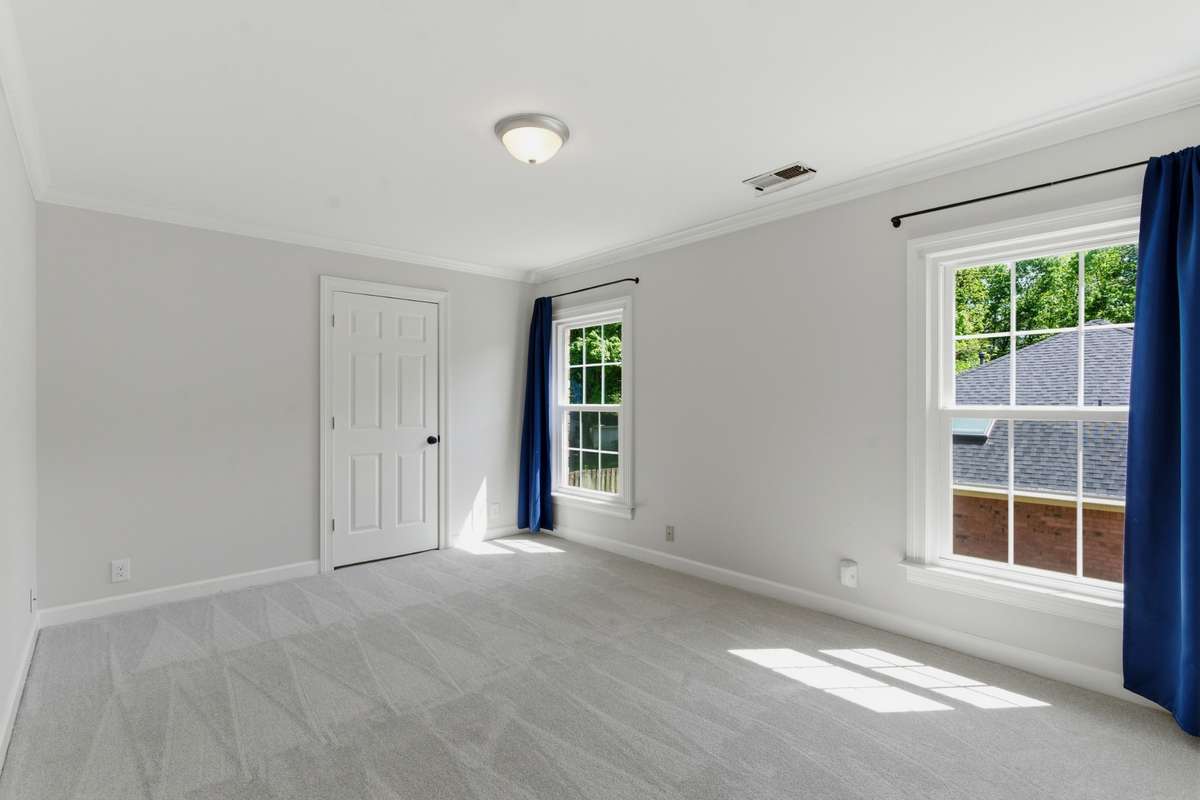 First of two upstairs bedrooms that share a hall bath.  Perfect for family or guests.