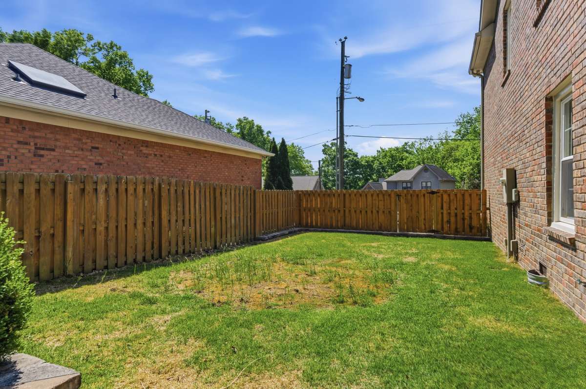 Private fenced side yard presents a great opportunity for customization - perfect for a play area, your garden or a personal putting green.