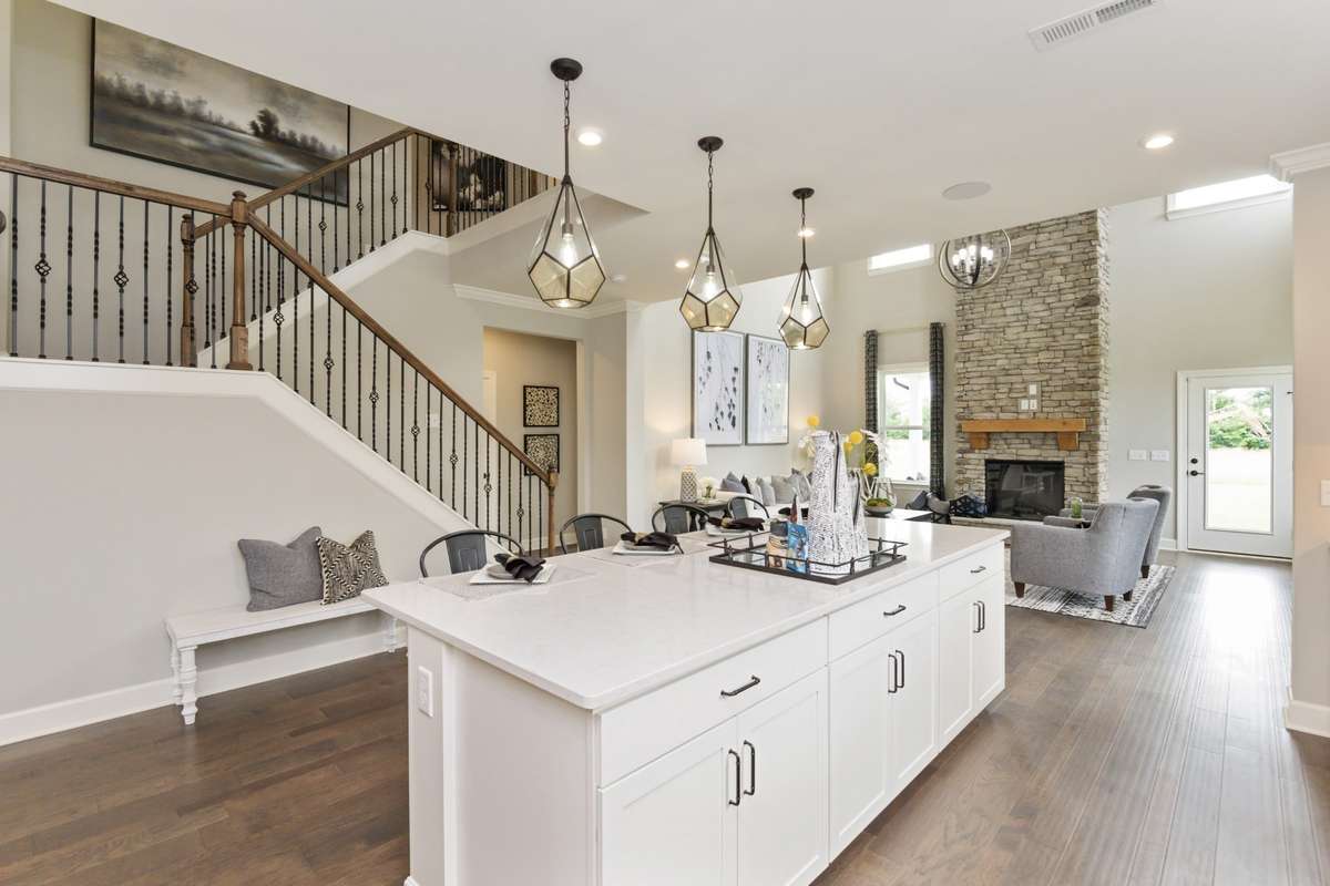 Open Concept Living! Large Island and Grand Staircase! Photos are of model home.
