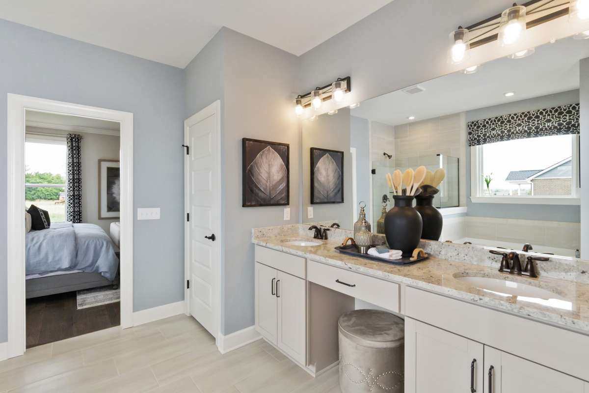Primary Bathroom Suite with double vanities! Photos are of model home.
