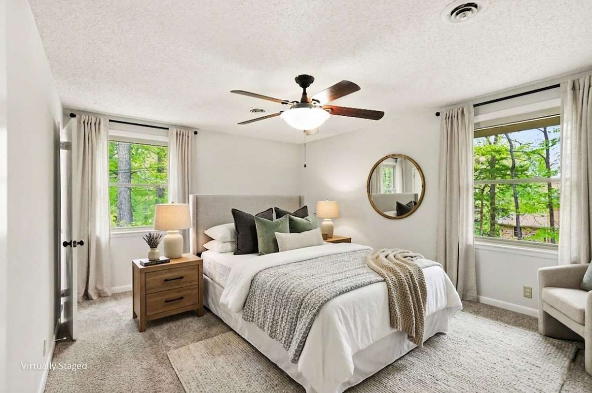 The large Primary Bedroom features two closets and a private full bathroom with tile shower.