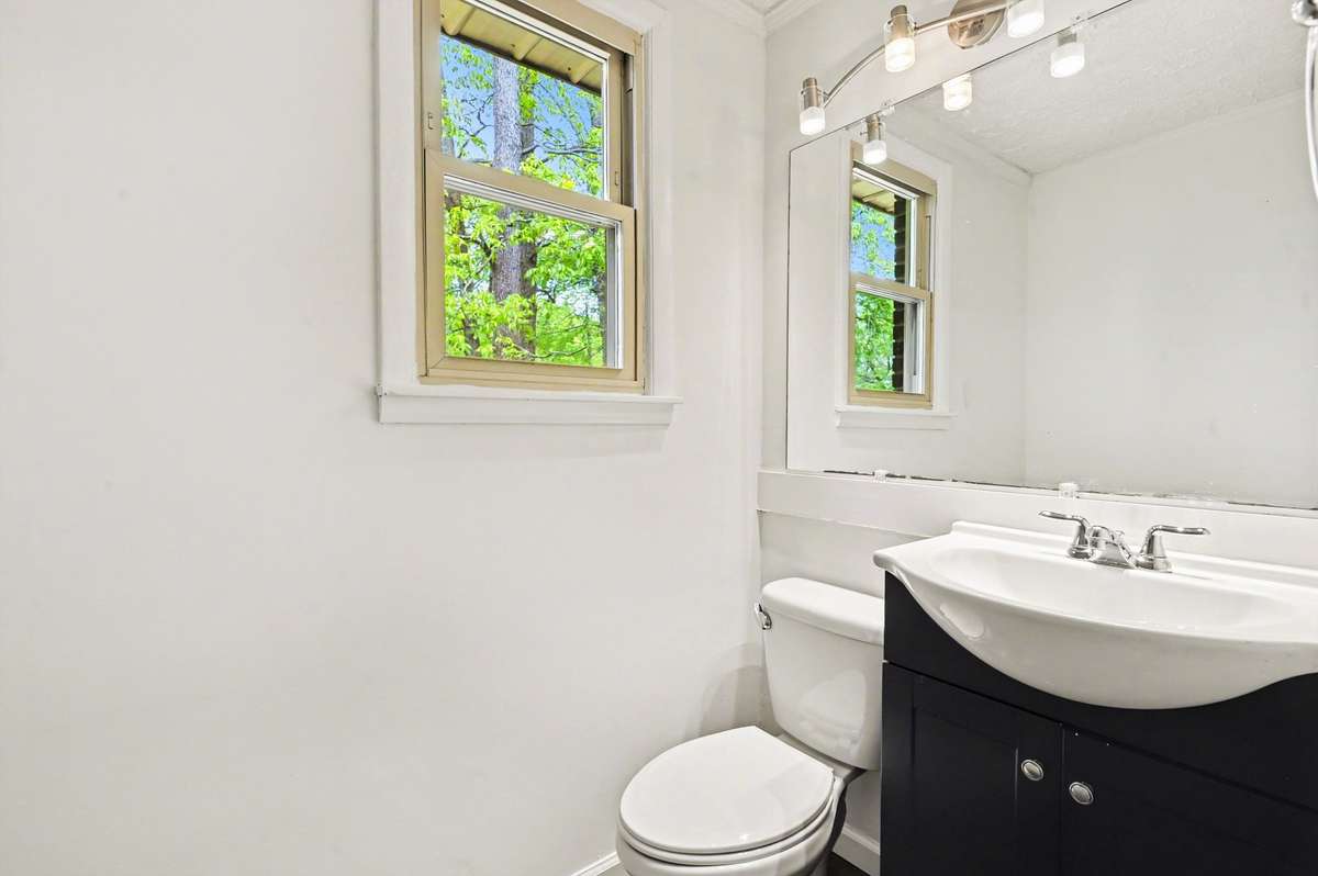 The main floor has a half bath located between the living room and pantry.