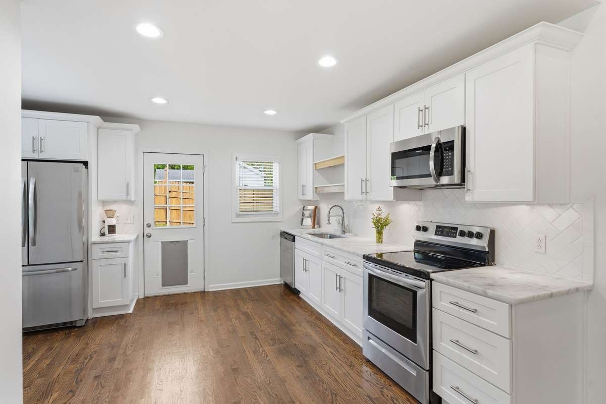 Great renovated kitchen that leads straight to the extra large deck.