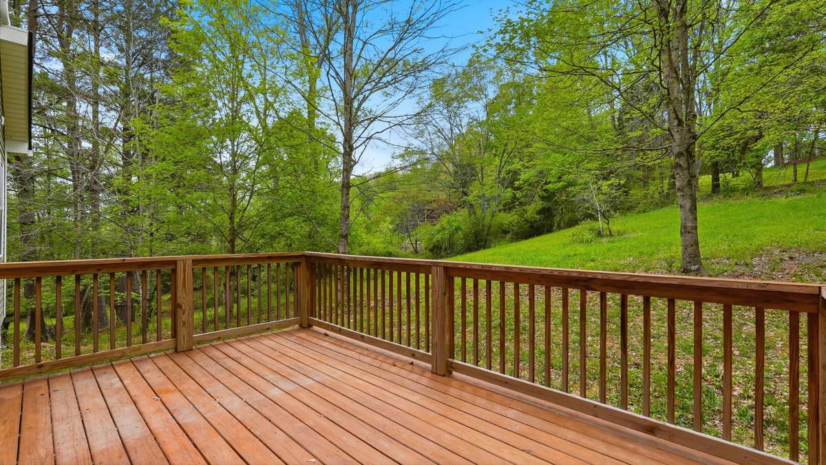 Large deck overlooking private yard