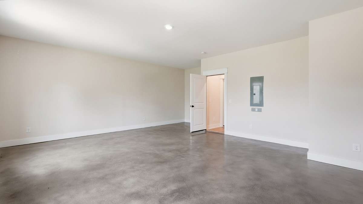large rec room over the garage on the main level of home
