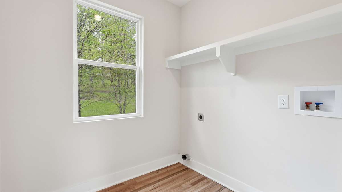 Laundry room located upstairs