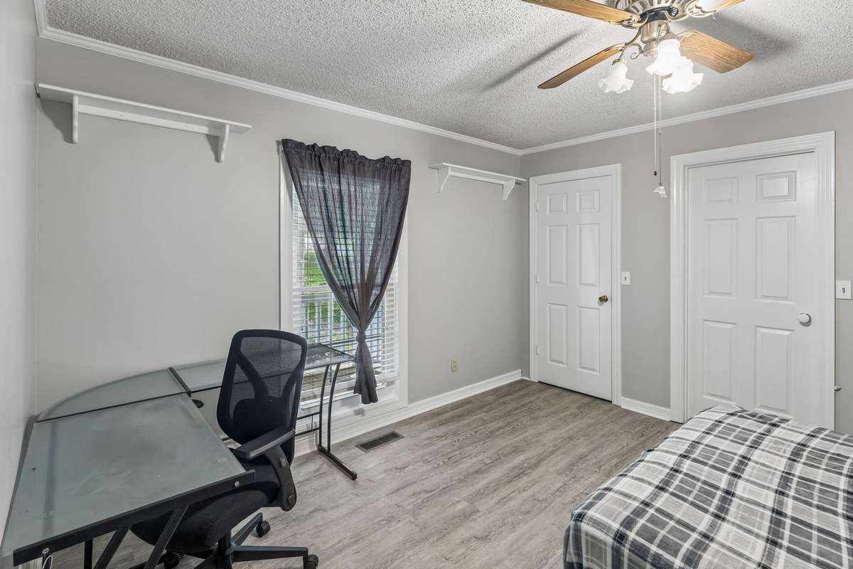 This light-filled and spacious guest bedroom also offers a large walk-in closet and jack-and-jill bathroom.