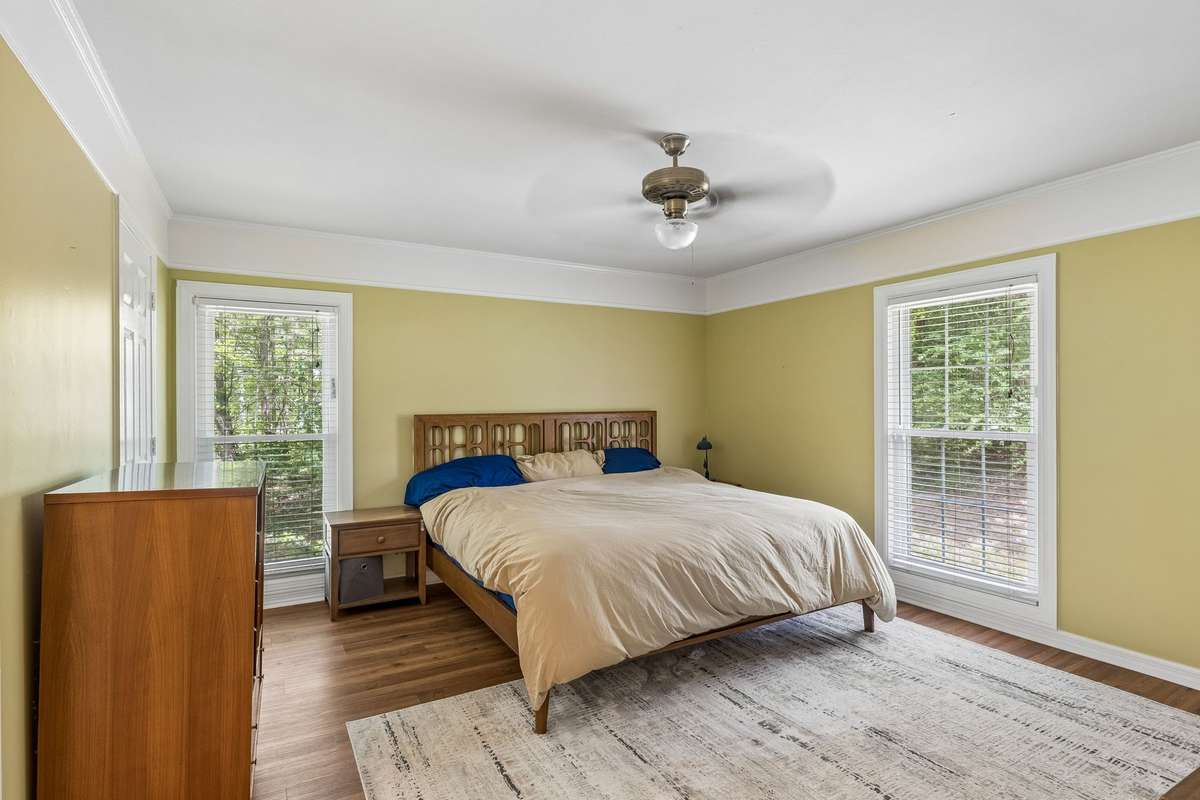 The primary bedroom is tucked away from the other bedrooms on the main floor creating a true escape.