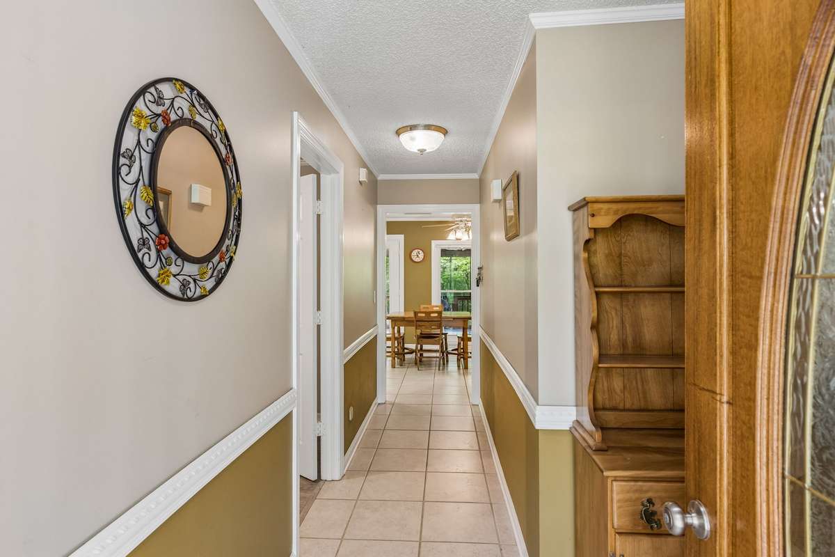 This inviting foyer sets the tone with a light-filled entry and a seamless flow into the heart of the home.