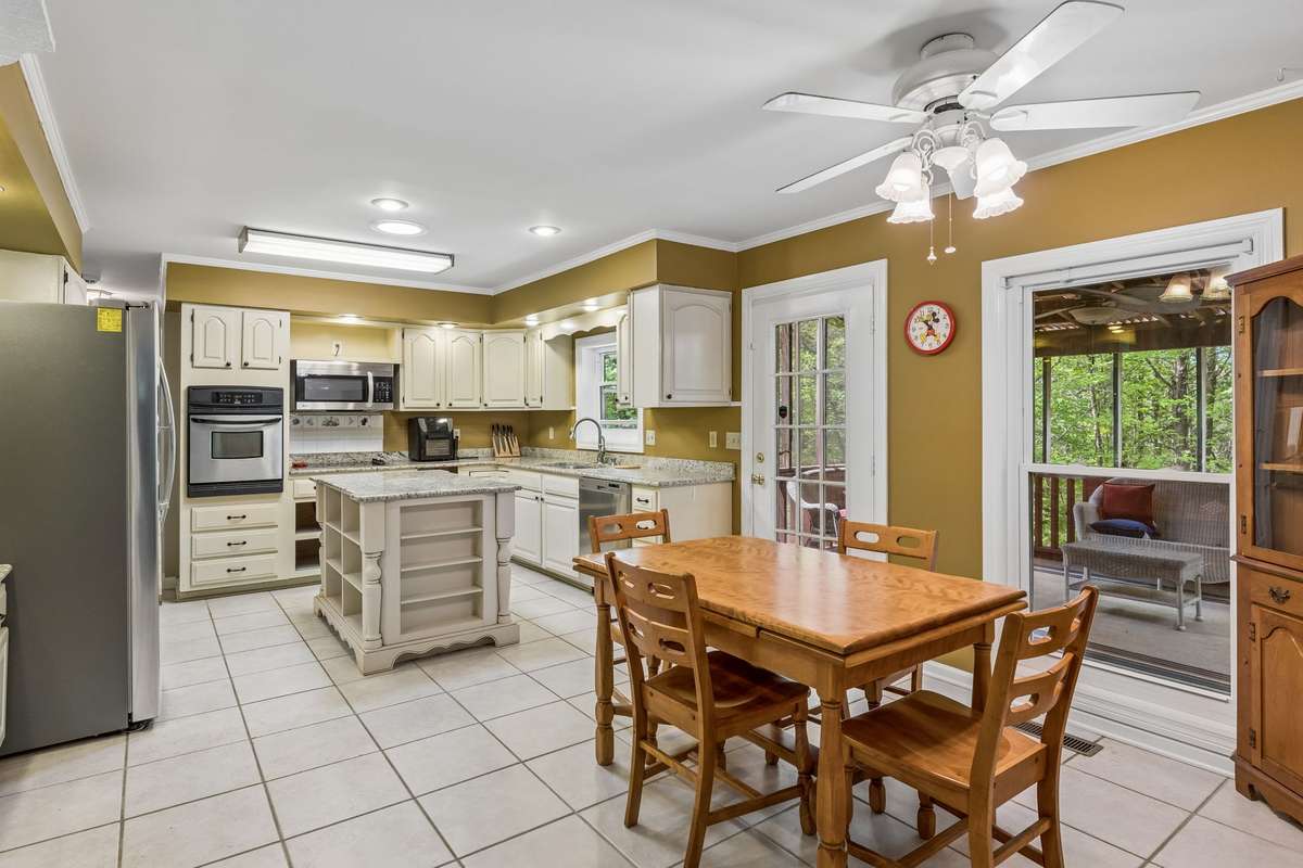The heart of the home  features a large island for gathering and a cozy breakfast nook—perfect for slow mornings, busy weekdays, and everything in between.