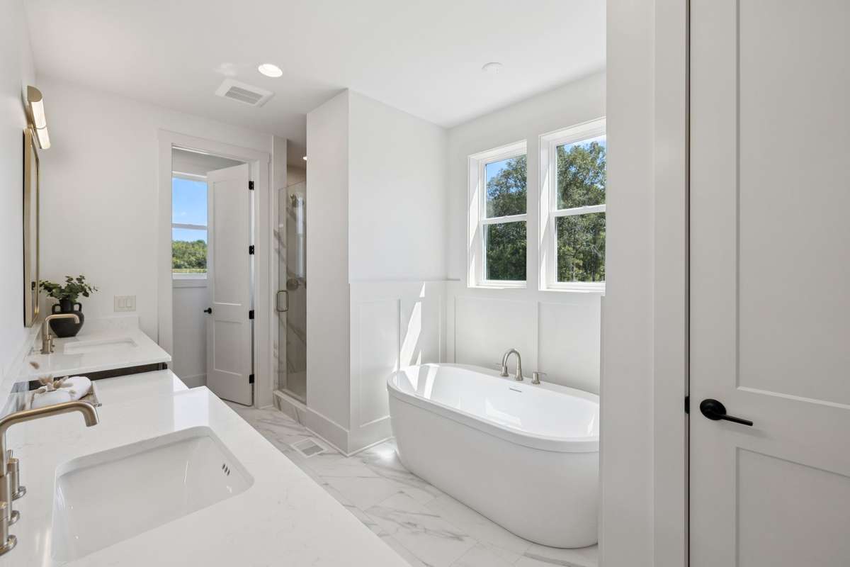 Not a Detail Missed in the Primary Bath! Spa Tub & Large Modern Vanities