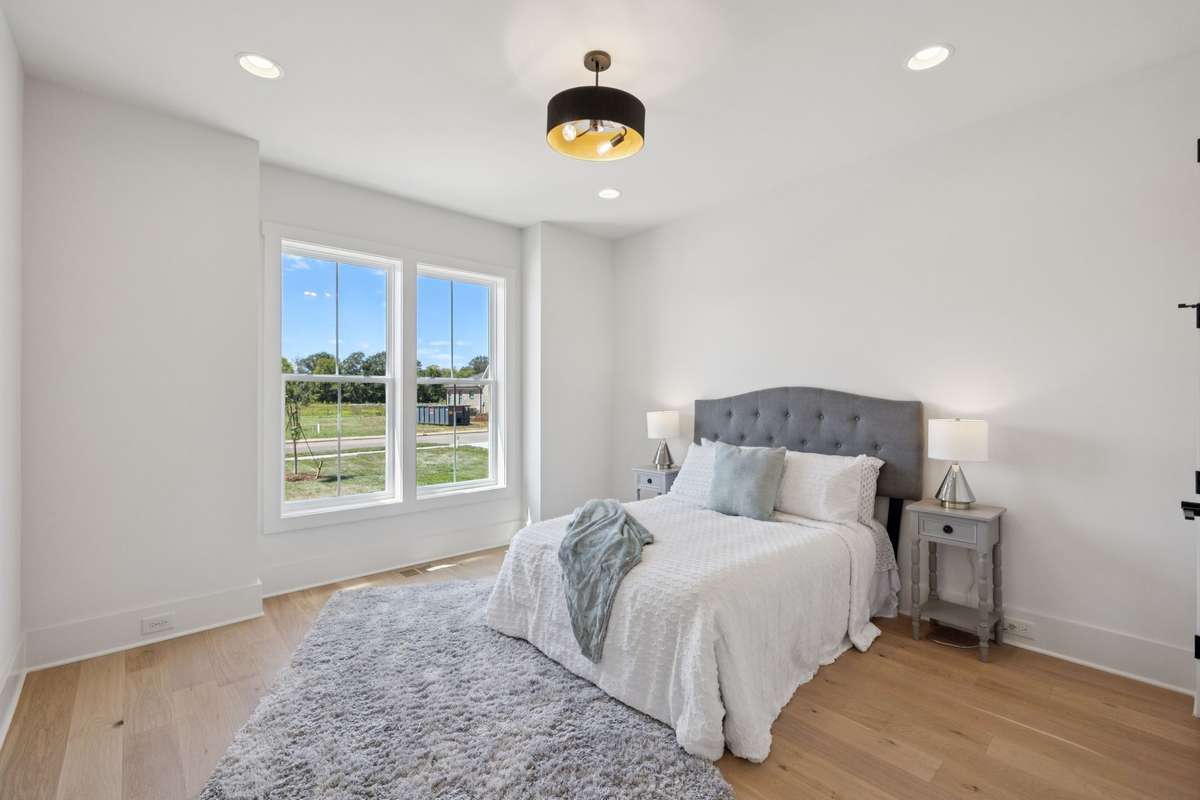 Main Floor Guest Bedroom.   Second Bedroom on Main Floor Along With The Primary Suite