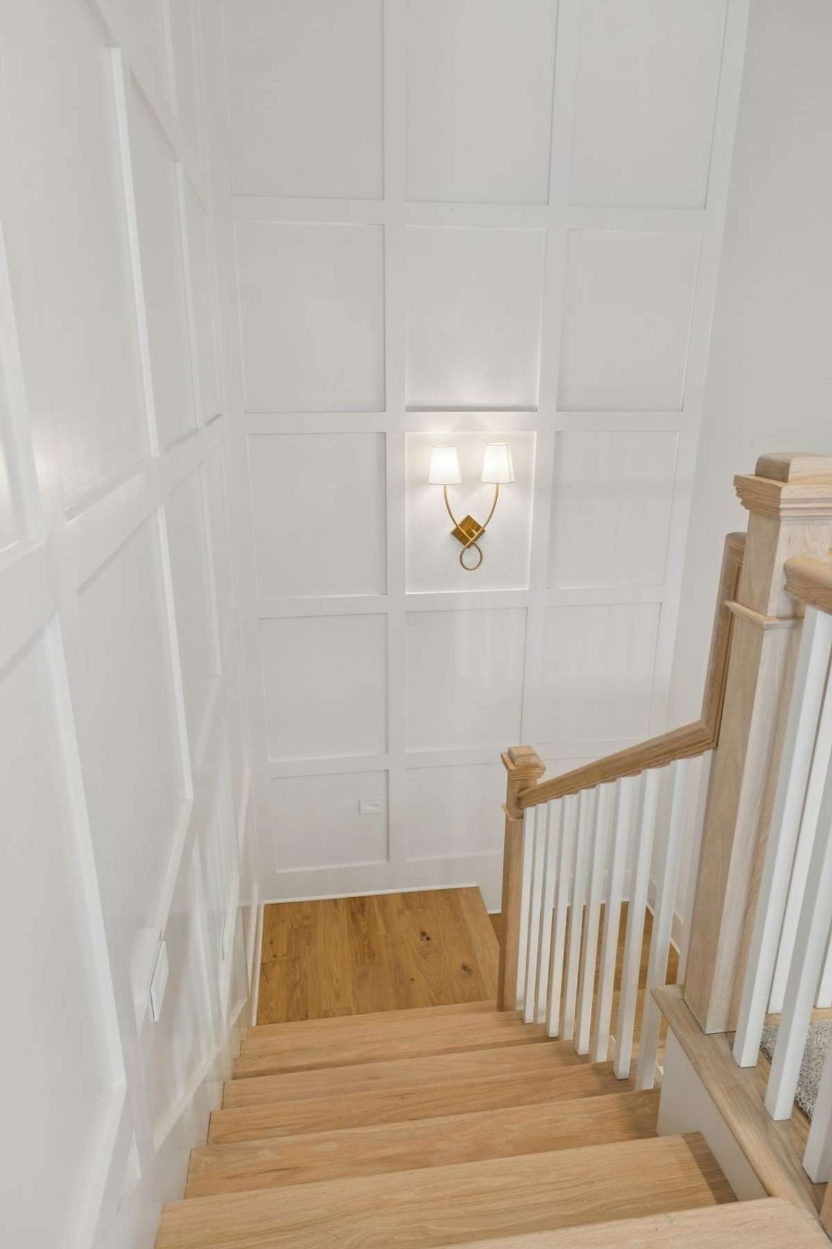 Stunning 2 Story Accent Wall dresses the Stairwell