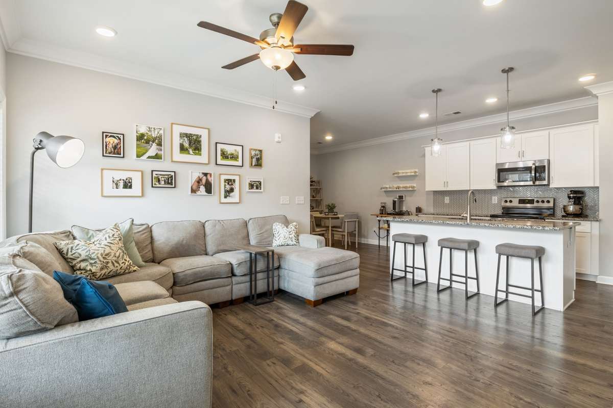 Entering from the patio, this first floor split bedroom plan provides sophisticated functionality with a crisp white kitchen, large island, hardwoods, & upgraded crown moldings. This residence is an ideal retreat located in beautiful Bellevue!