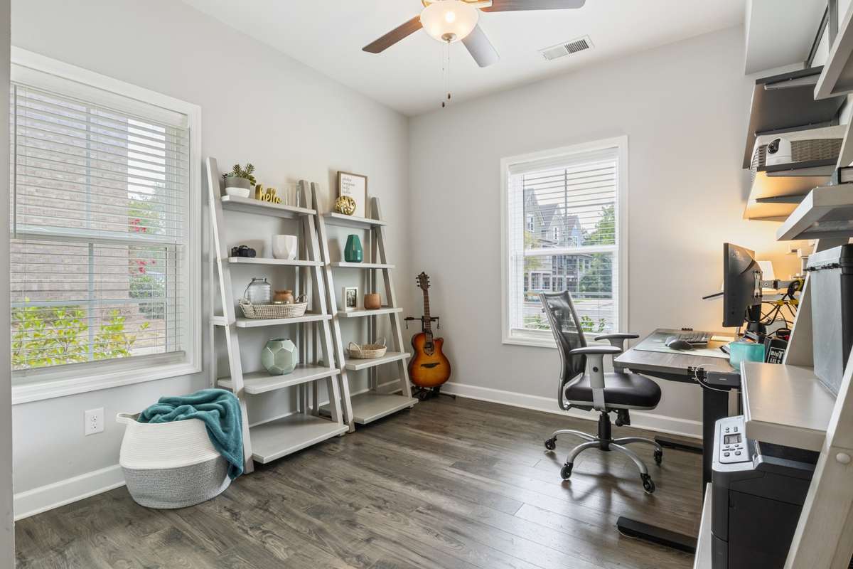 The secondary bedroom is being used as an office but could also accomodate a guest room. With 2 windows, there is an abundance of natural light!