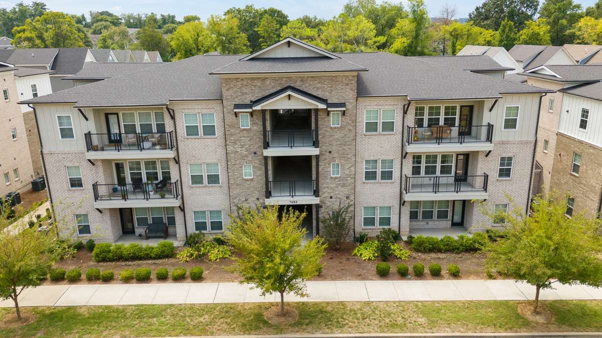 Front side view of 7483 Hwy 70S. (facing Hwy 70 S). The condominium is located on the other side of the building.