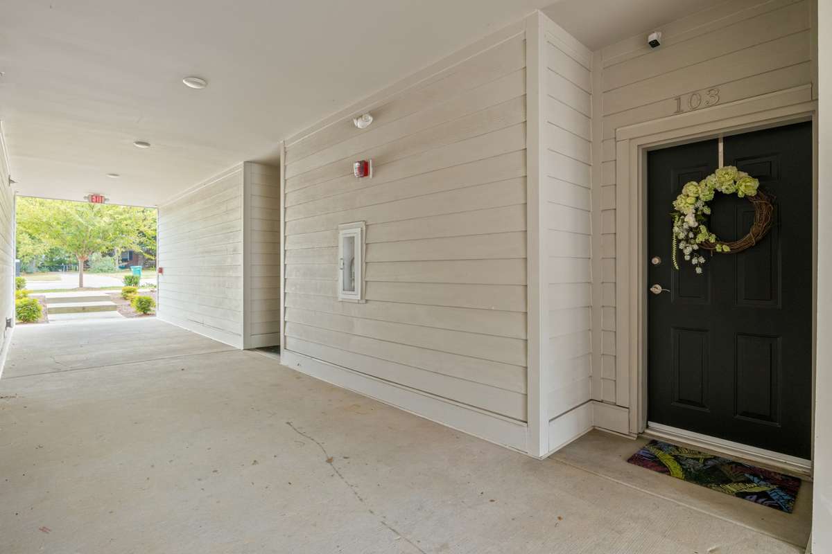 This entrance can be accessed from the street side or the parking lot and opens into the entrance hall by the dining room.