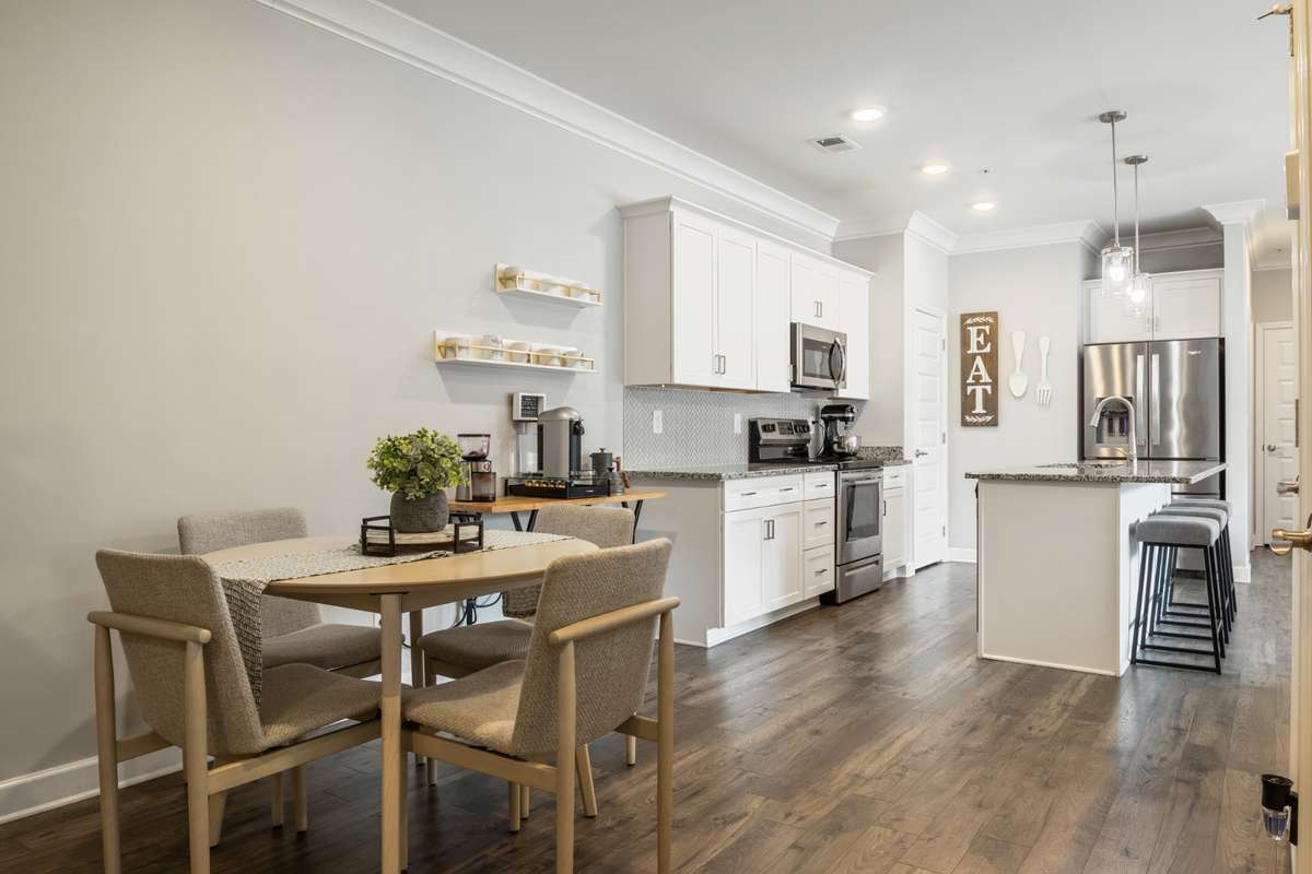 The dining area and the large bar are open to the living room and perfect for entertaining guests or a cozy night in.