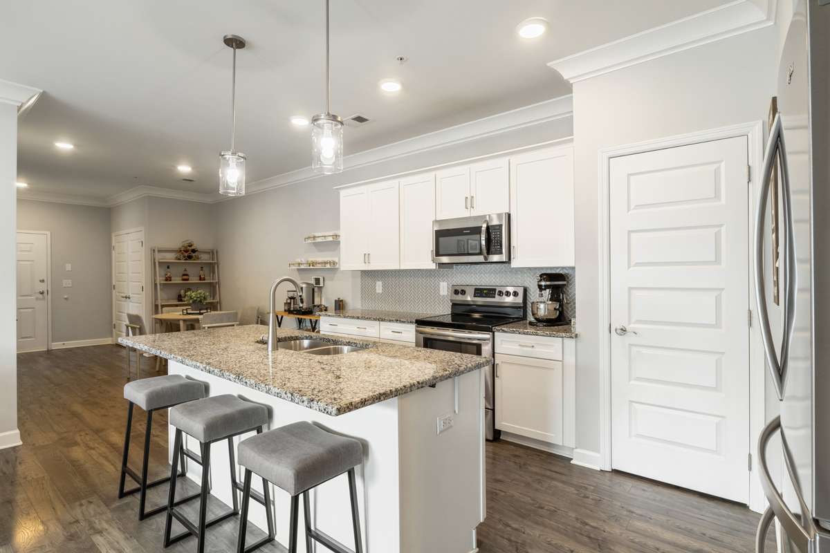 The open concept kitchen offers both a large island and dining area! The pantry is perfect for extra food and appliance storage.