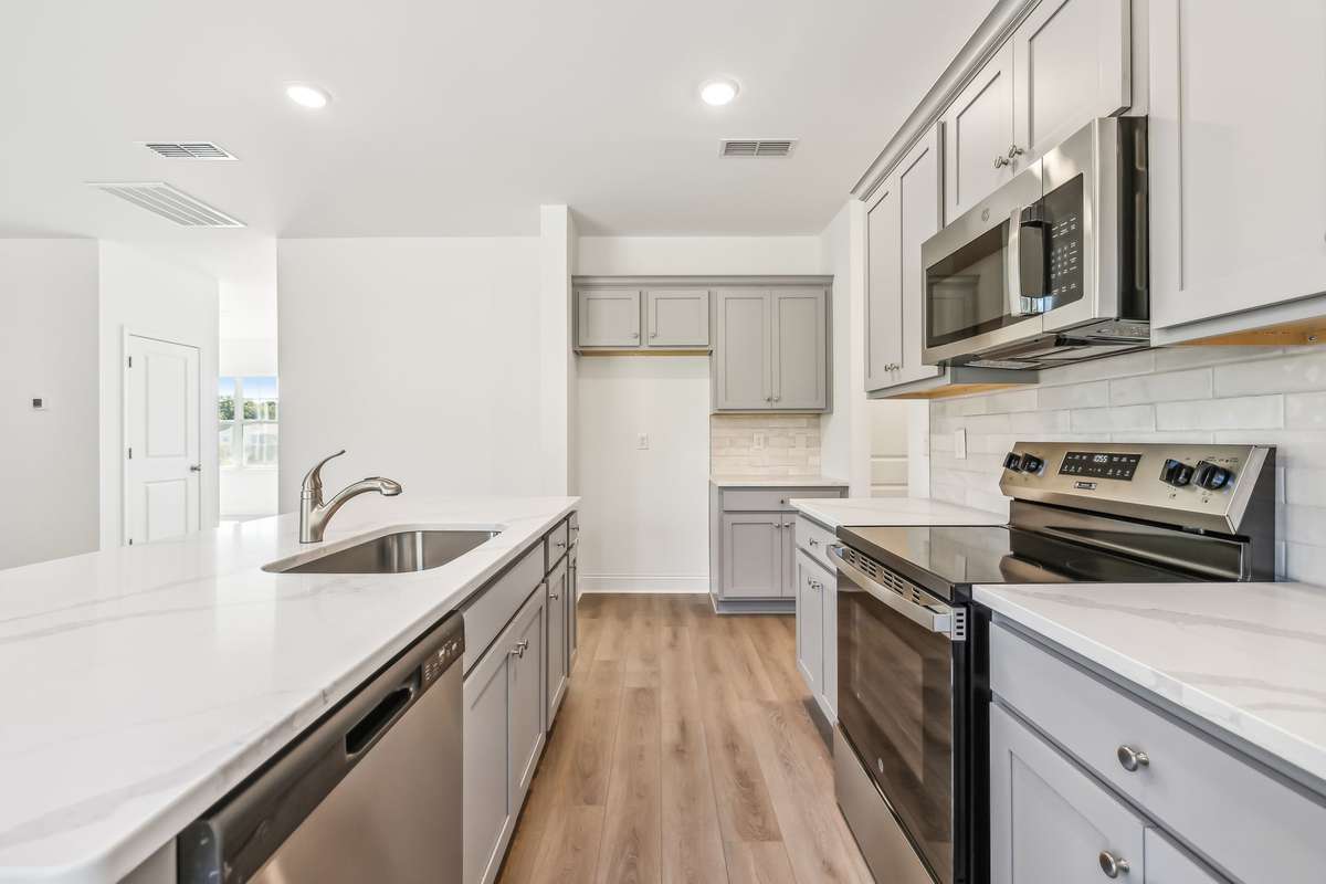 Westmore kitchen. Photo is of similar home, same plan. Options may vary.