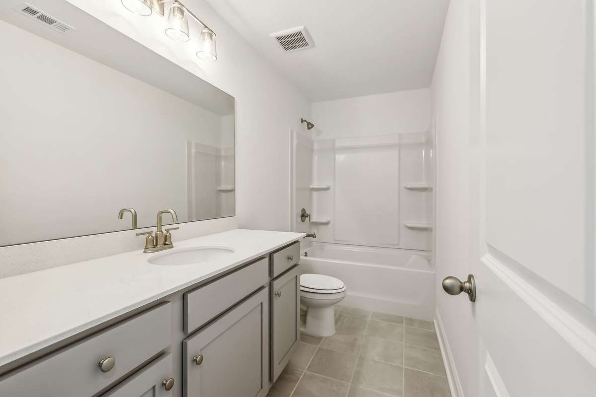 Westmore guest bath. Photo is of similar home, same plan. Options may vary.