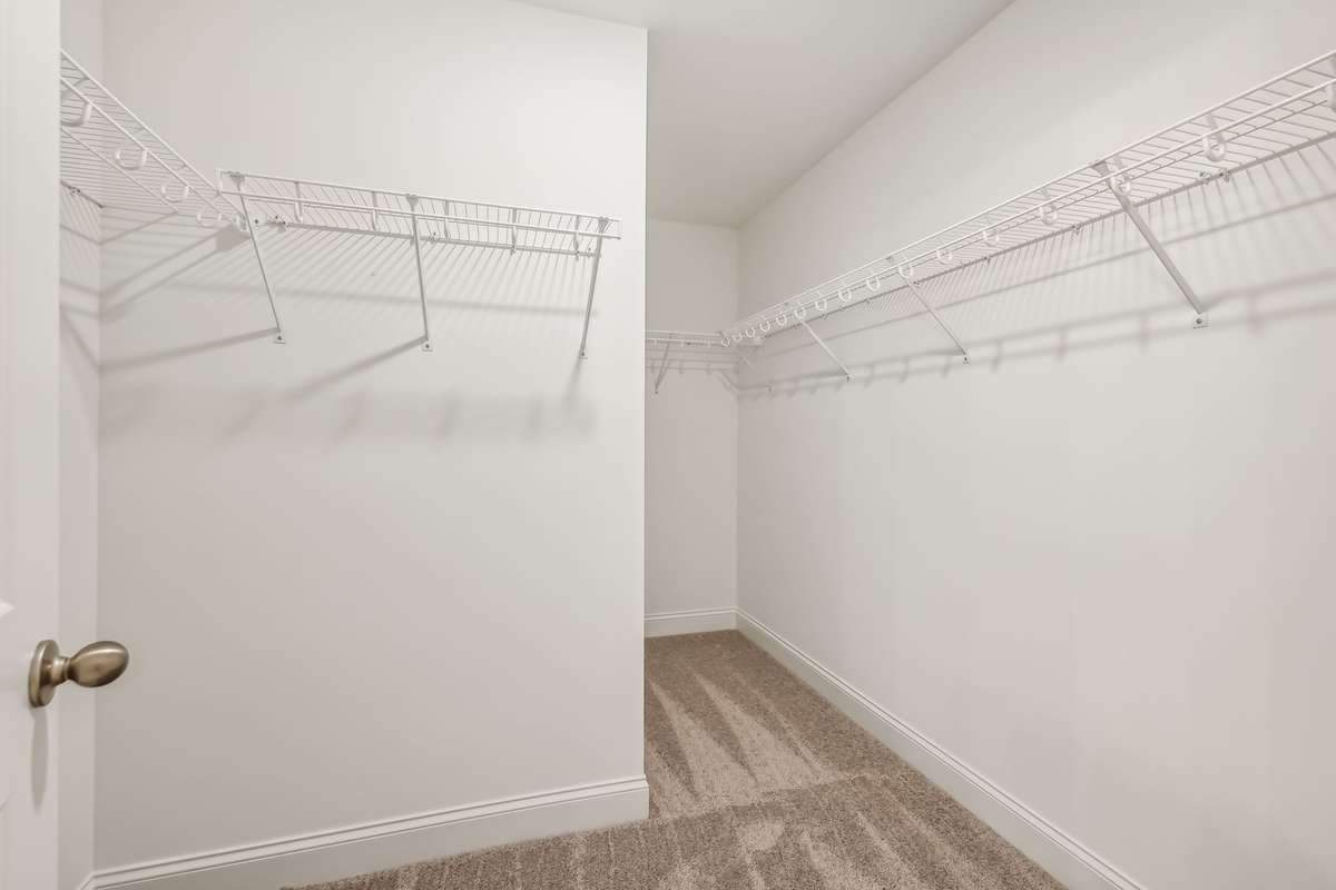 Westmore primary closet. Photo is of similar home, same plan. Options may vary.